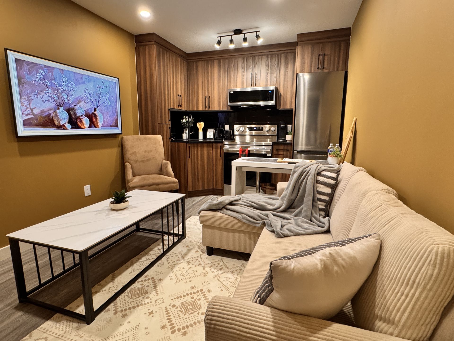 The Two-Bedroom Deluxe Apartment — the living room and kitchen